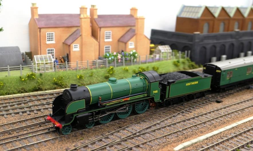 An unlikely photograph for a real Ewhurst Green. However, one of the joys of running sessions permits visiting early BR Blue liveried Merchant Navy 35024 'East Asiatic Company' to pass BR Green liveried 35011 General Steam Navigation; the latter being a recent metal-bodied release under the Hornby-Dublo brand (albeit in lined blue 3-rail packaging).