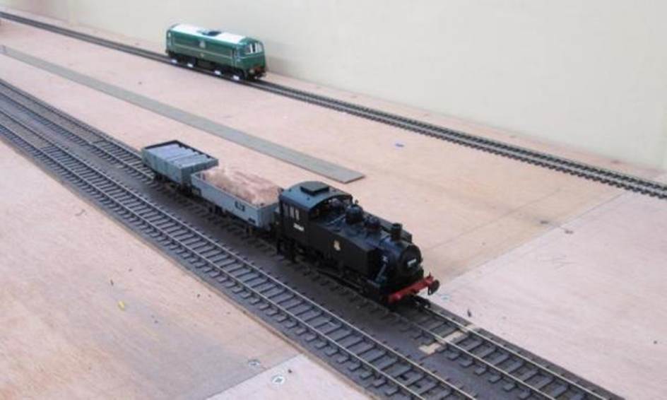 With HA E5001 on the test circuit, USA tank no.30069 tries the (then) 
recently laid Down Main through what will become the platform area.
www.EwhurstGreen.com 
