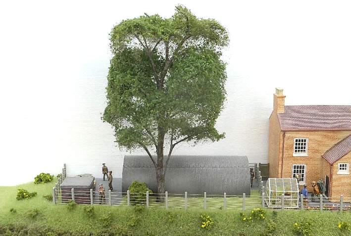 Soldiers go about their business of decommissioning a wartime army Nissen hut which has become surplus to requirements. In the corner is the ROF brick pill-box.
www.EwhurstGreen.com
