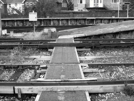Protection-boarded conductor rails used to run through many of the walkways at Horsham station.
www.EwhurstGreen.com 
